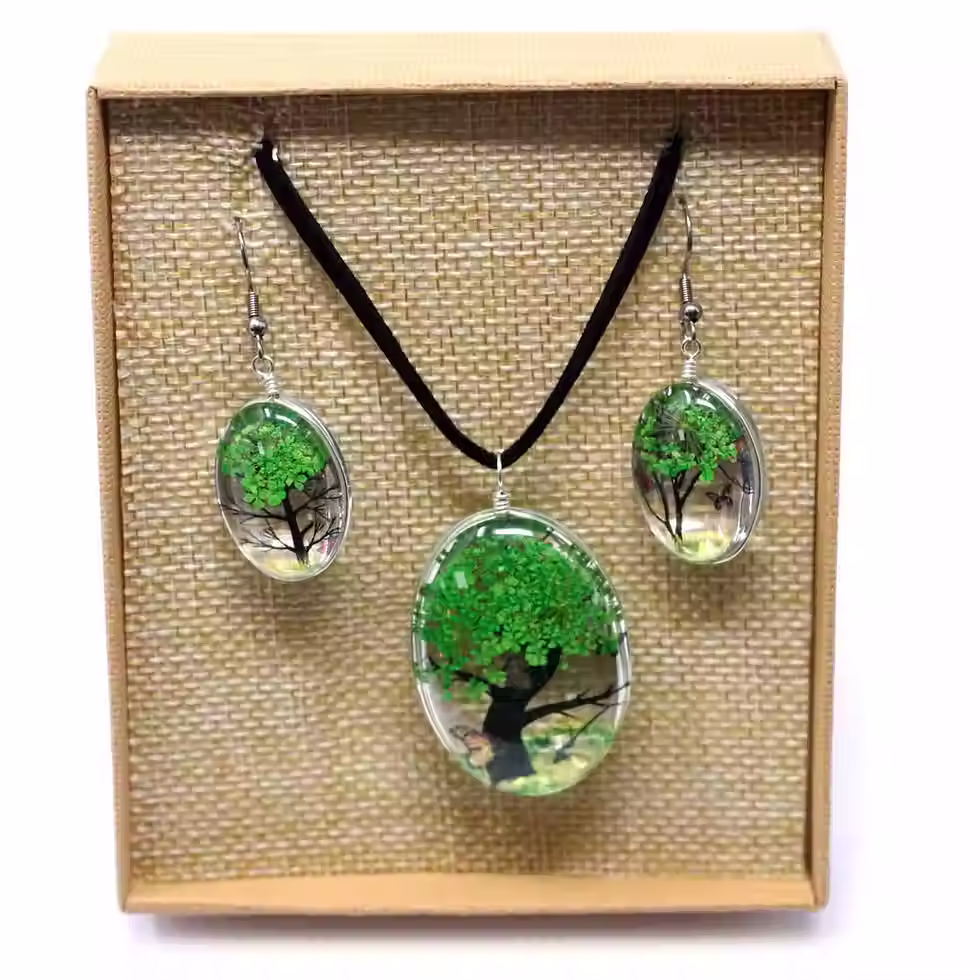 Thumbnail: Tree of Life green pressed flower jewellery set with necklace and matching earrings in gift box.