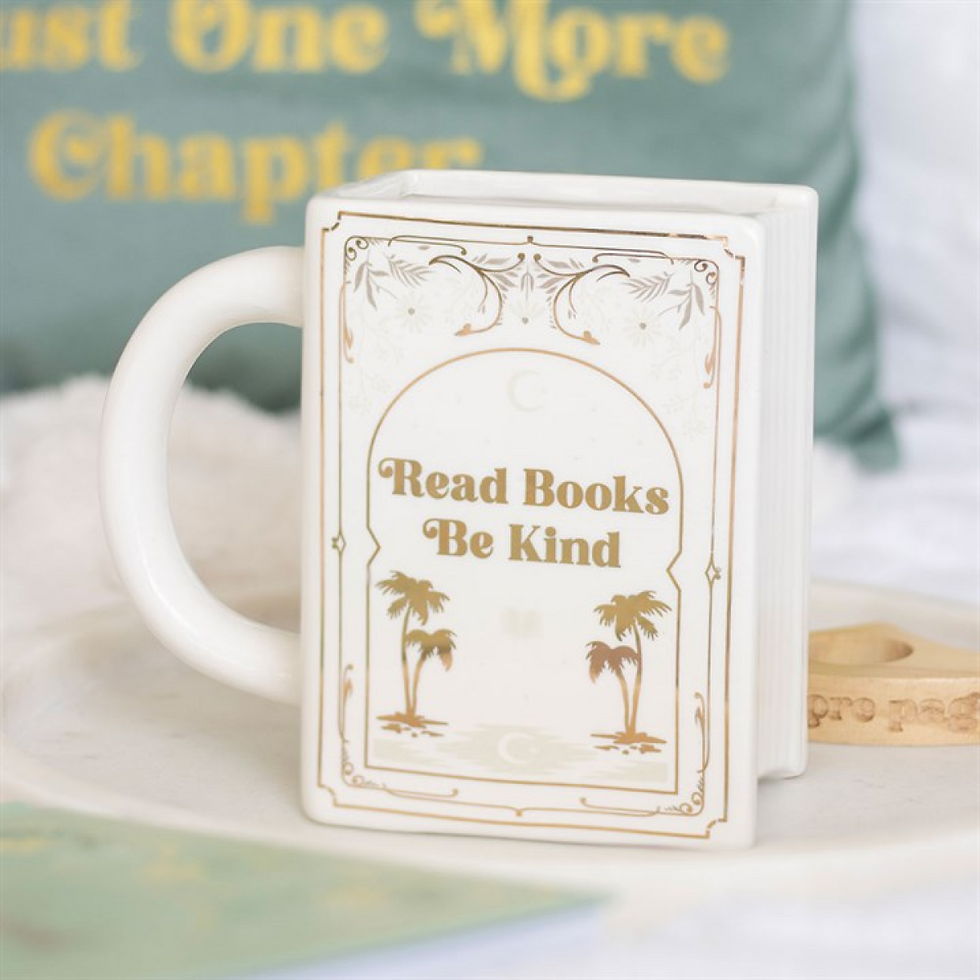 White ceramic book-shaped mug printed with ‘Read Books Be Kind