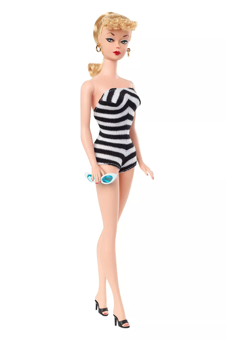 Photo: Original Barbie Doll 1959, Amazon / Barbie Media / Mattel. Barbie doll in black and white stripey swimsuit