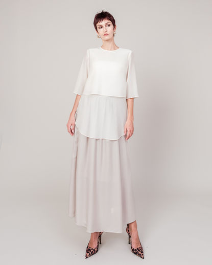 Organdy vest and sheer organdy blouse styled together, featuring a light, translucent texture and soft, airy volume. The layered transparency creates a refined, modern elegance characteristic of DOMELLE 25AW.
