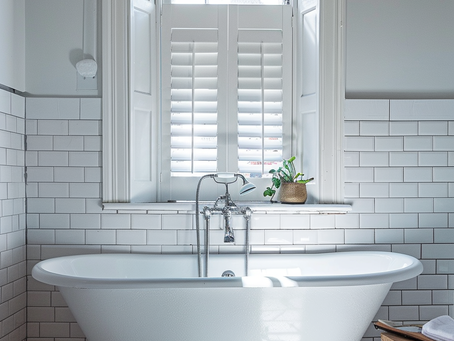 A close up of a window shutter in a bathroom in Leyton East London