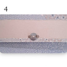 Les deux parties de l'aimant sont posées, l'une sur le rabat, l'autre sur la structure