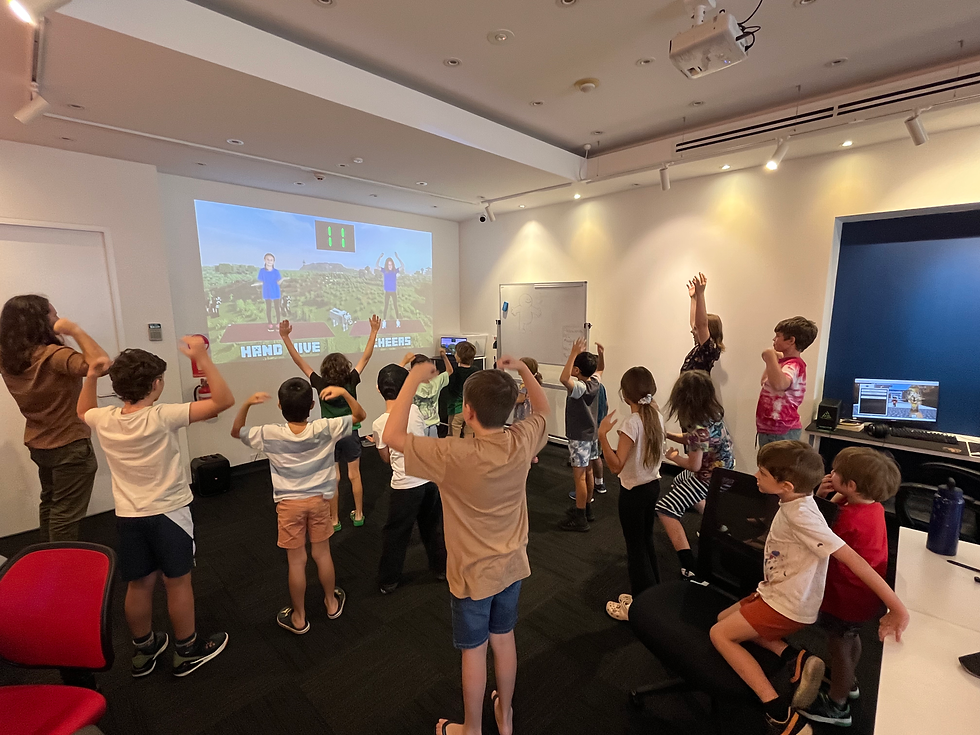 Children and adults engaged in a projected interactive game