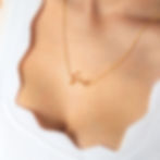 Woman wearing Feral in gold