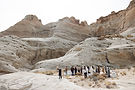Group gathers in desert canyon