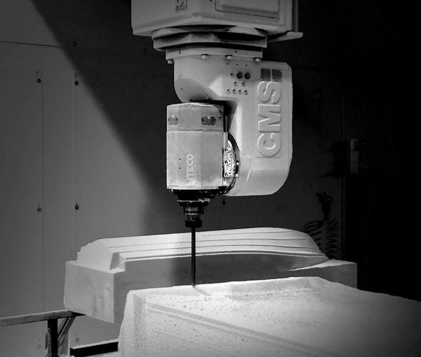 CNC milling machine precisely cuts boat hull