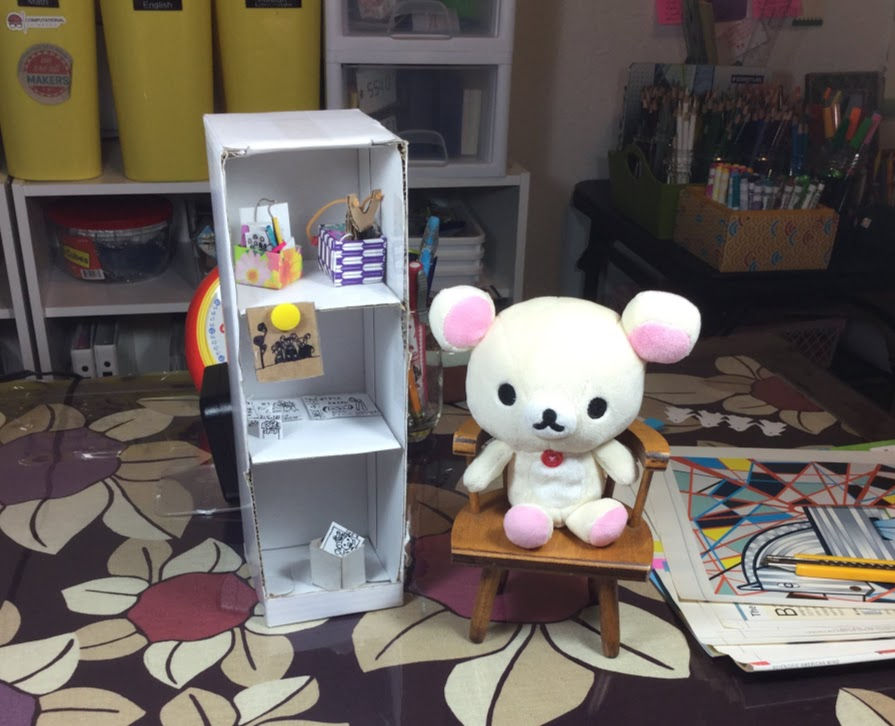 A miniature white shelf for Korilakkuma.