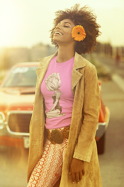 70s-styled-t-shirt-mockup-featuring-a-joyful-woman-wearing-a-flower-behind-her-ear-m10513.