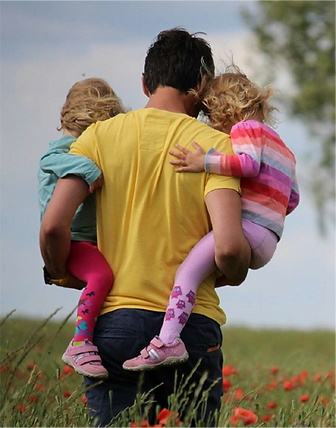 Dad-carrying-kids-representing-family-focused-budgeting-strategies