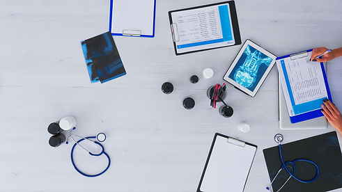 doctor-checking-medical-record-on-desktop-top-view-WDTDNMQ.jpg
