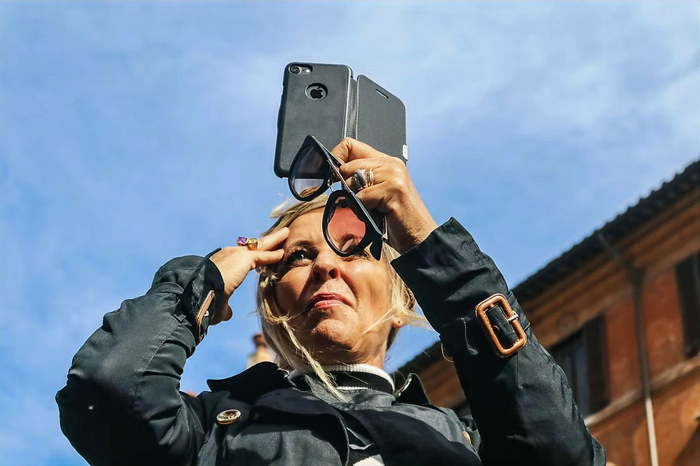 woman uses secondary phone while traveling alone