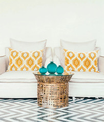 Three Momofiore Balloton vases in Paraiba green pictured on a coffee table