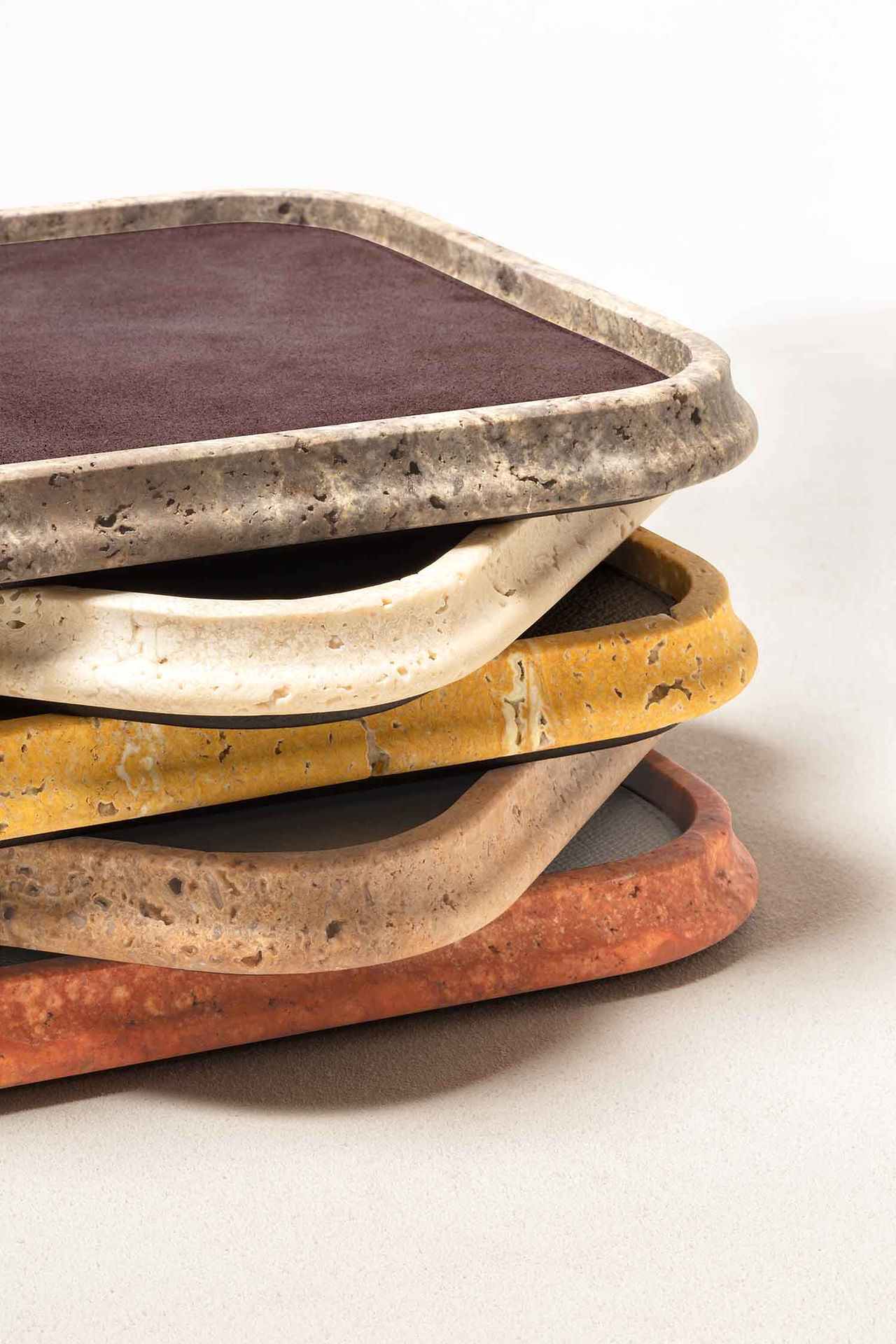Stack of Rodi marble valet trays showing the five marble colours available