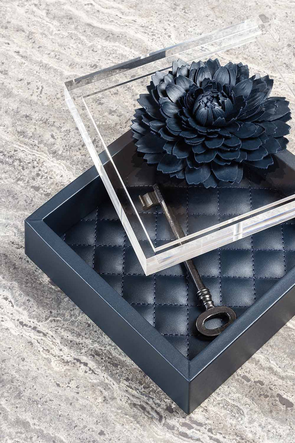Fleur Dahlia box by Riviere, pictured in navy blue smooth leather with plexiglass lid