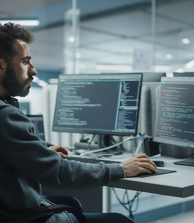 Diverse Office_ IT Programmer Working on Desktop Computer. Male Specialist Creating Innova