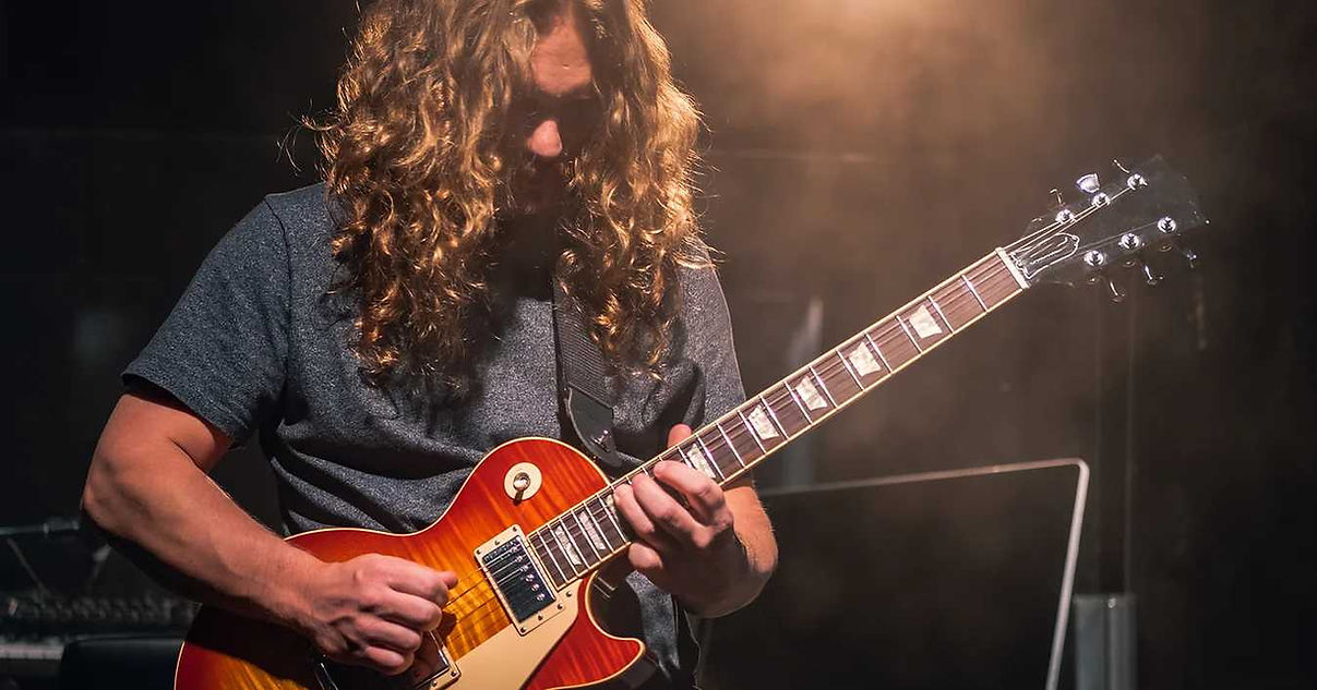 Student playing guitar 1.webp