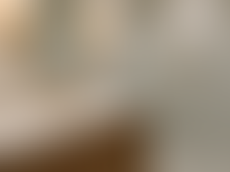 Ventilation long-lasting luxury bathroom Houston with hidden vent fan, marble vanity, and wood cabinetry.