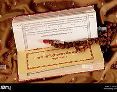 Ancient Vedas, the sacred texts of Hinduism, representing profound wisdom, knowledge, and spiritual teachings passed down through generations, written in Sanskrit on traditional manuscripts