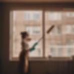 Lady cleaning office window brown aesthetic .jpg