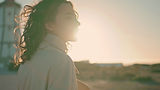 woman-with-curly-hair-looking-at-sunset-2026-01-05-23-34-34-utc.jpg