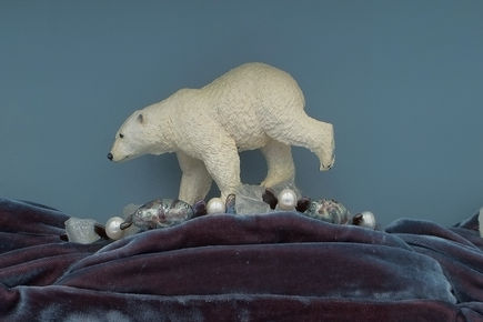 Polar bear on quartz necklace and blue velvet.