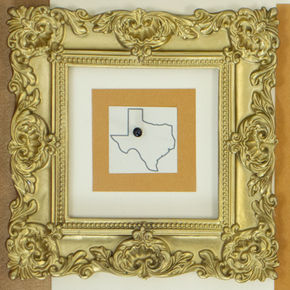 Gold framed photo of the state of Texas.