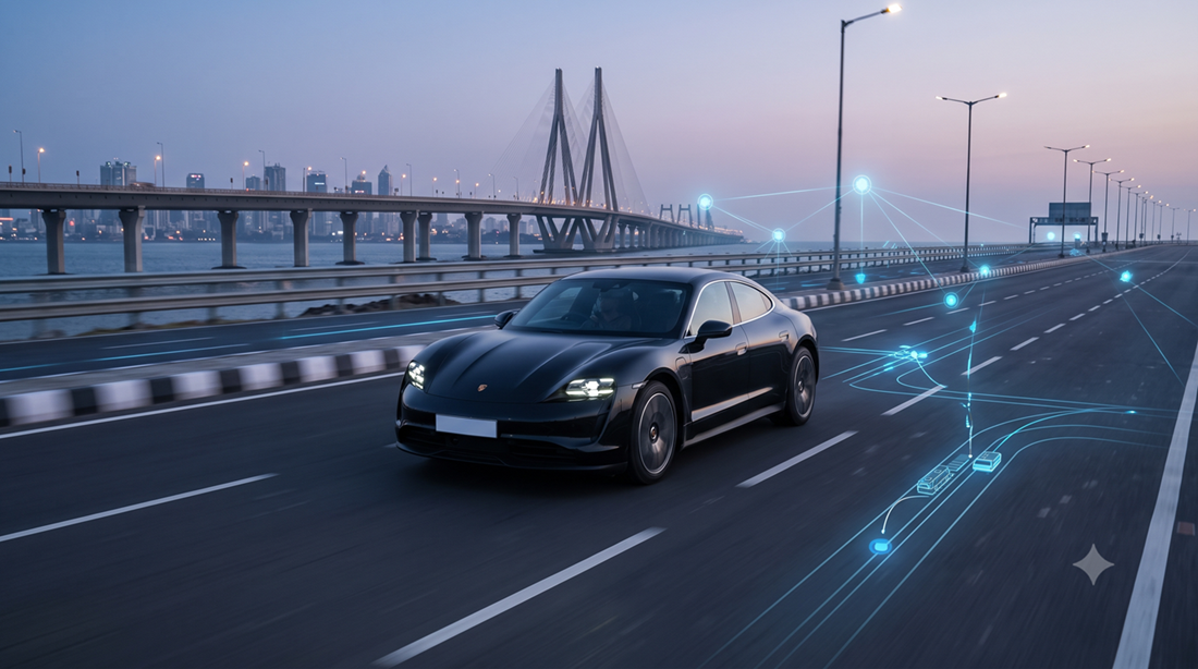 A vehicle travelling along a lit coastal flyover at dusk, with the Mumbai skyline and a connected-technology overlay in the background.
