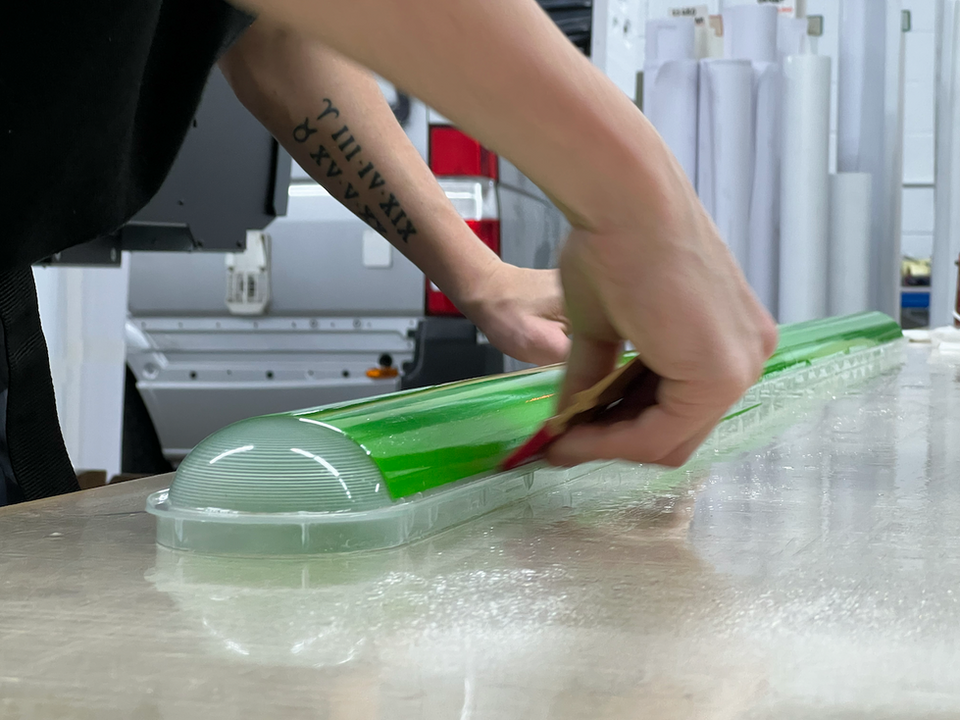 Green vinyl wrapped light covers prepared for use in a potato storage facility