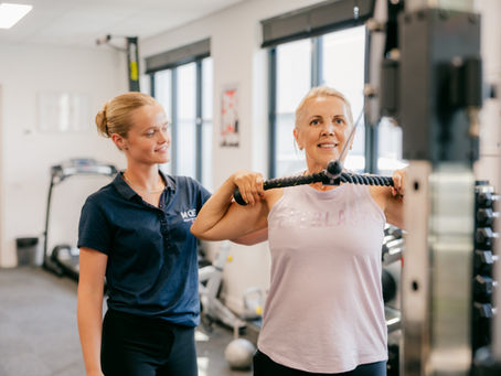 Female Physiotherapist working with client in gym at Move Sports Physiotherapy & Pilates Geelong
