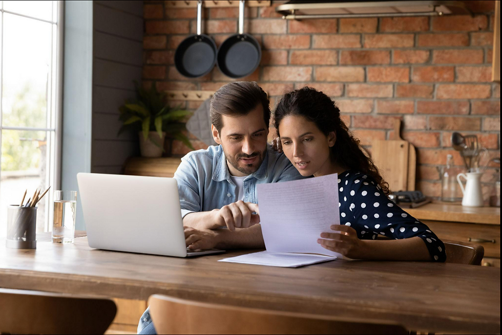Couple reviewing and discussing life insurance document for financial planning