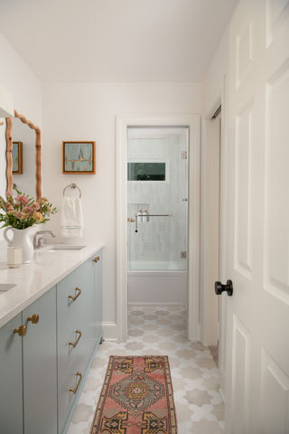 Hall bathroom renovation with custom cabinetry and lighting in SouthPark home