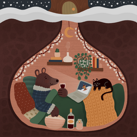 A bear in pajamas is watching television in a cozy underground bed with a glass of wine and popcorn. A cat is sleeping at the foot of the bed.
