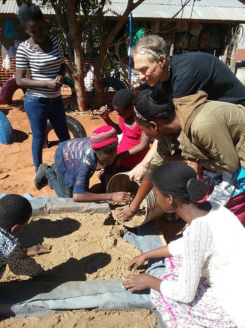 Retired art teacher Russell Ford with students at WayiWayi Gallery in Livingstone, Zambia