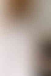 bride putting on an Anne Barge wedding dress at Melrose Mansion in New Orleans, LA