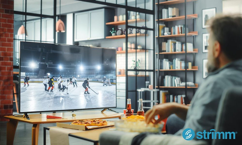 A man watching a niche sports event stream on a custom tv channel