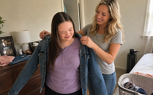 Woman supporting client with jacket