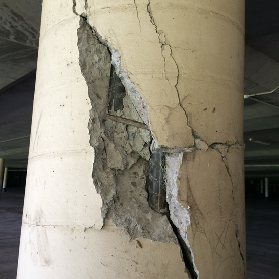 Close-up view of a hairline crack in concrete pavement