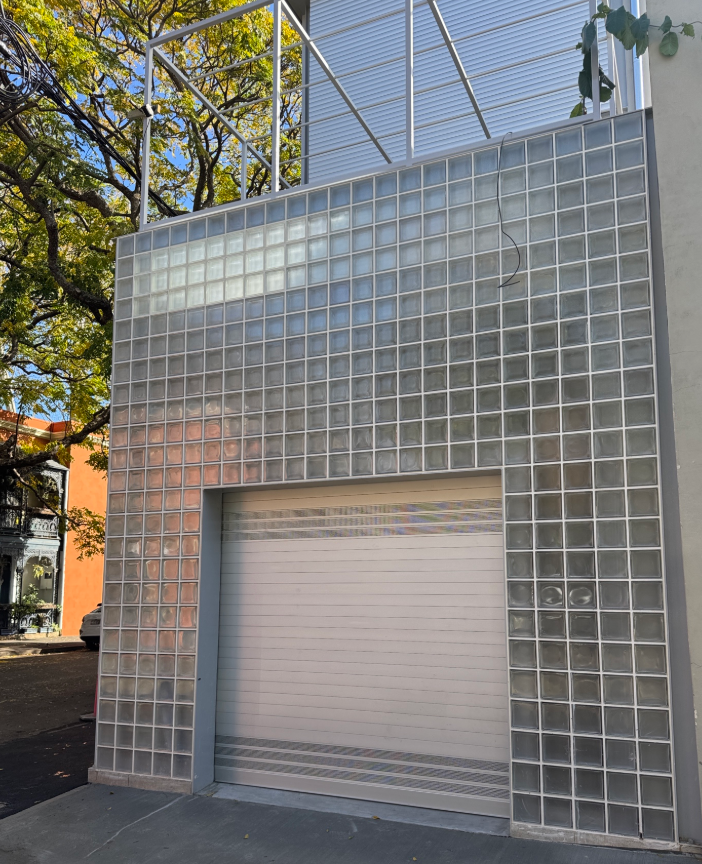Glass facade and roller shutter