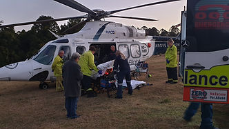 Paramedics transferring a patient from an ambulance to a Life Flight rescue helicopter