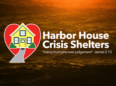 House icon in a red heart over sunset ocean. Text: Harbor House Crisis Shelters, "mercy triumphs over judgement" -James 2:13.