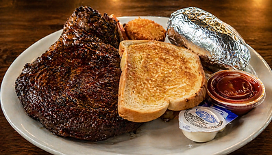 Hand-cut steak dinner with baked potato and Texas toast