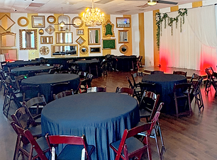 Casseberry indoor private events venue with tables, chairs, and linens