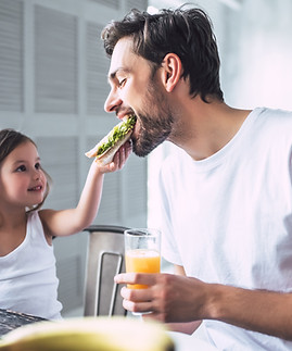 Father and Daughter Having Breakfast