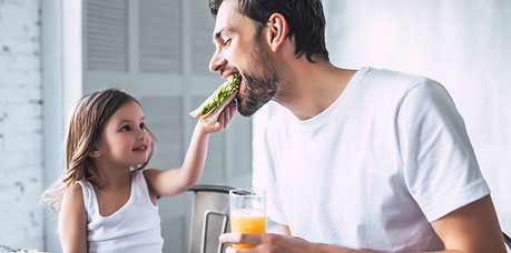 Father and Daughter Having Breakfast