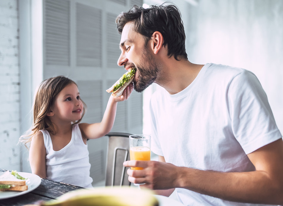 Father and Daughter Having Breakfast