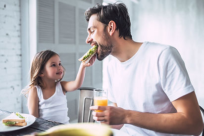 Father and Daughter Having Breakfast