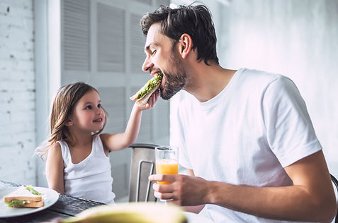 Father and Daughter Having Breakfast