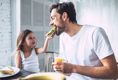 Father and Daughter Having Breakfast
