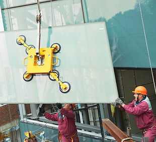 Window installation on a commercial building completed by ABC Exteriors Inc.