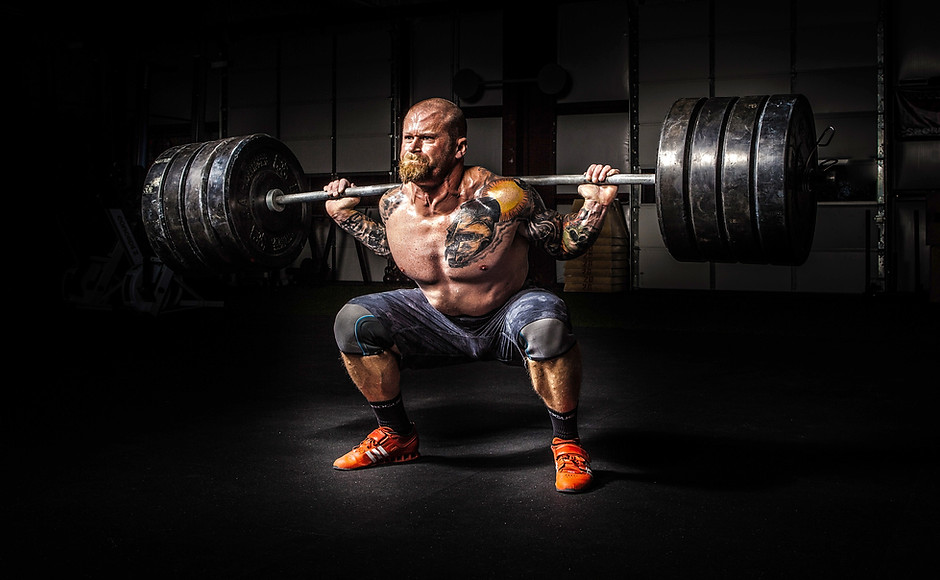 Strongman Doing Power Squat